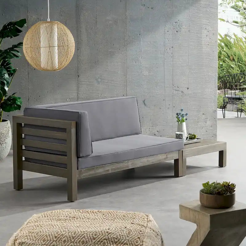 Causeuse d'extérieur Oana en bois d'acacia avec accoudoir gauche et table basse avec coussin par Christopher Knight Home